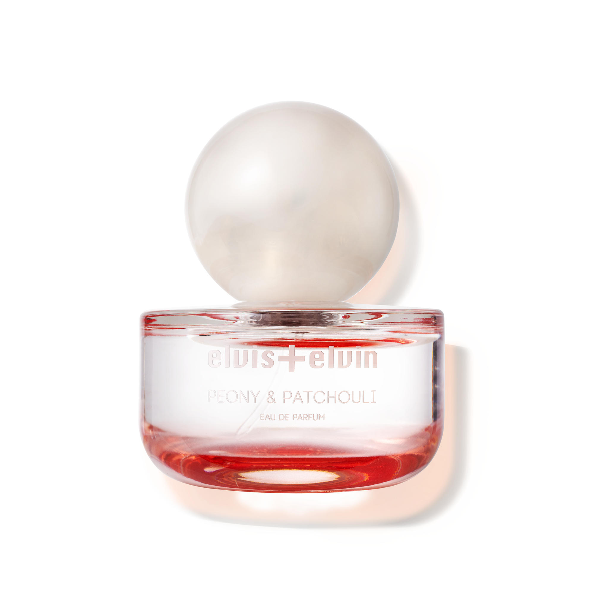 elvis+elvin Peony & Patchouli, 50ml, Perfume bottle with a pearl on top against a white background